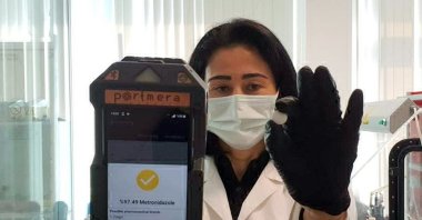 Dr. Derya Cebeci shows the device she developed, in Istanbul, Turkey, Feb. 9, 2021. (DHA PHOTO) 