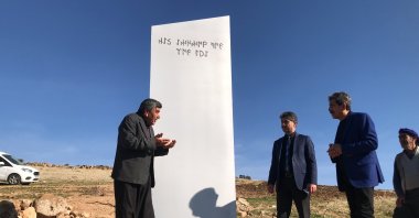 People talk near the then-mysterious monolith in southeastern Şanlıurfa province on Feb. 8, 2021 (AA Photo)
