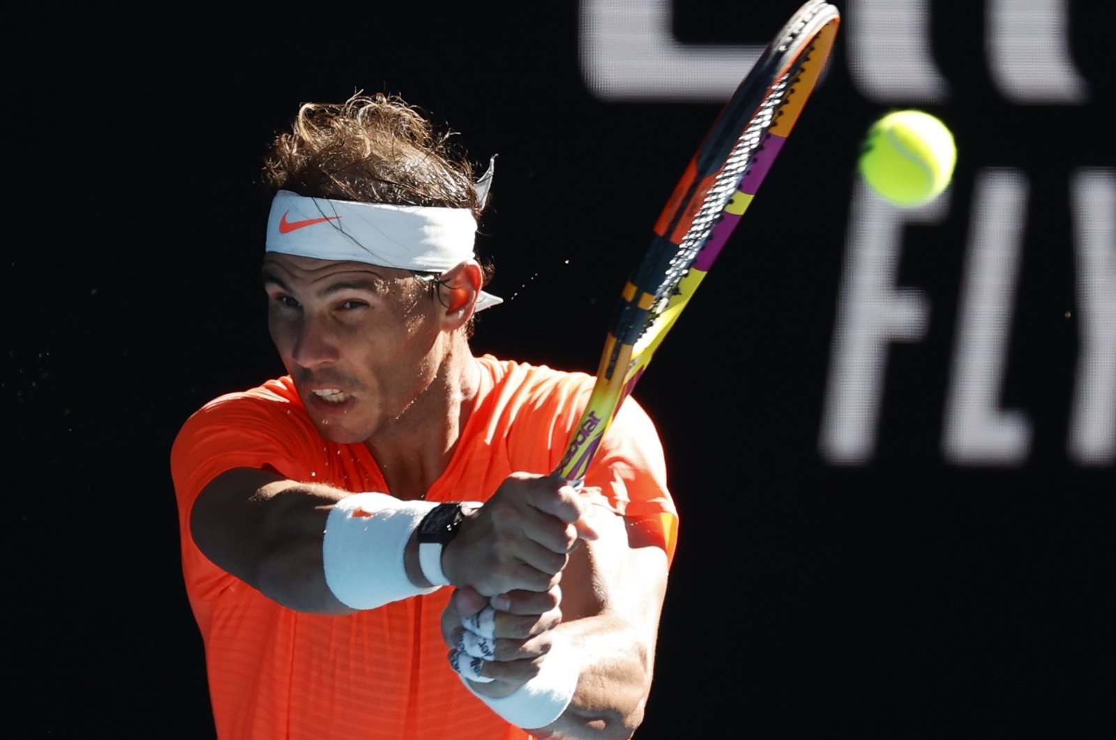 Spain's Rafael Nadal makes a backhand return to Serbia's Laslo Djere during their first-round match at the Australian Open, in Melbourne, Australia, Feb. 9, 2021. (AP Photo)
