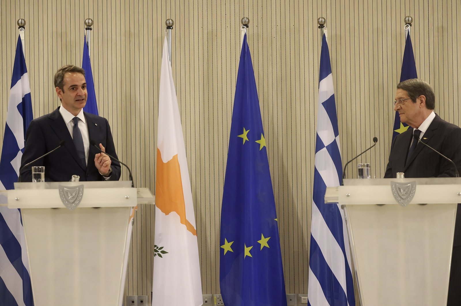 Greek Prime Minister Kyriakos Mitsotakis (L) and Greek Cypriot leader Nicos Anastasiades talk during a press conference after their meeting at the presidential palace in Nicosia on the island of Cyprus, Feb. 8, 2021. (AP Photo)