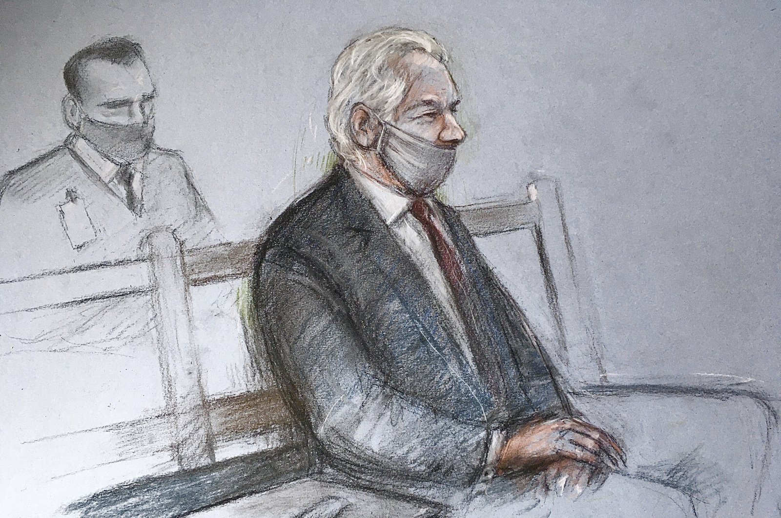 This is a court artist sketch by Elizabeth Cook of Julian Assange appearing at the Old Bailey in London for the ruling in his extradition case, in London, Monday, Jan. 4, 2021. (Elizabeth Cook / PA via AP)