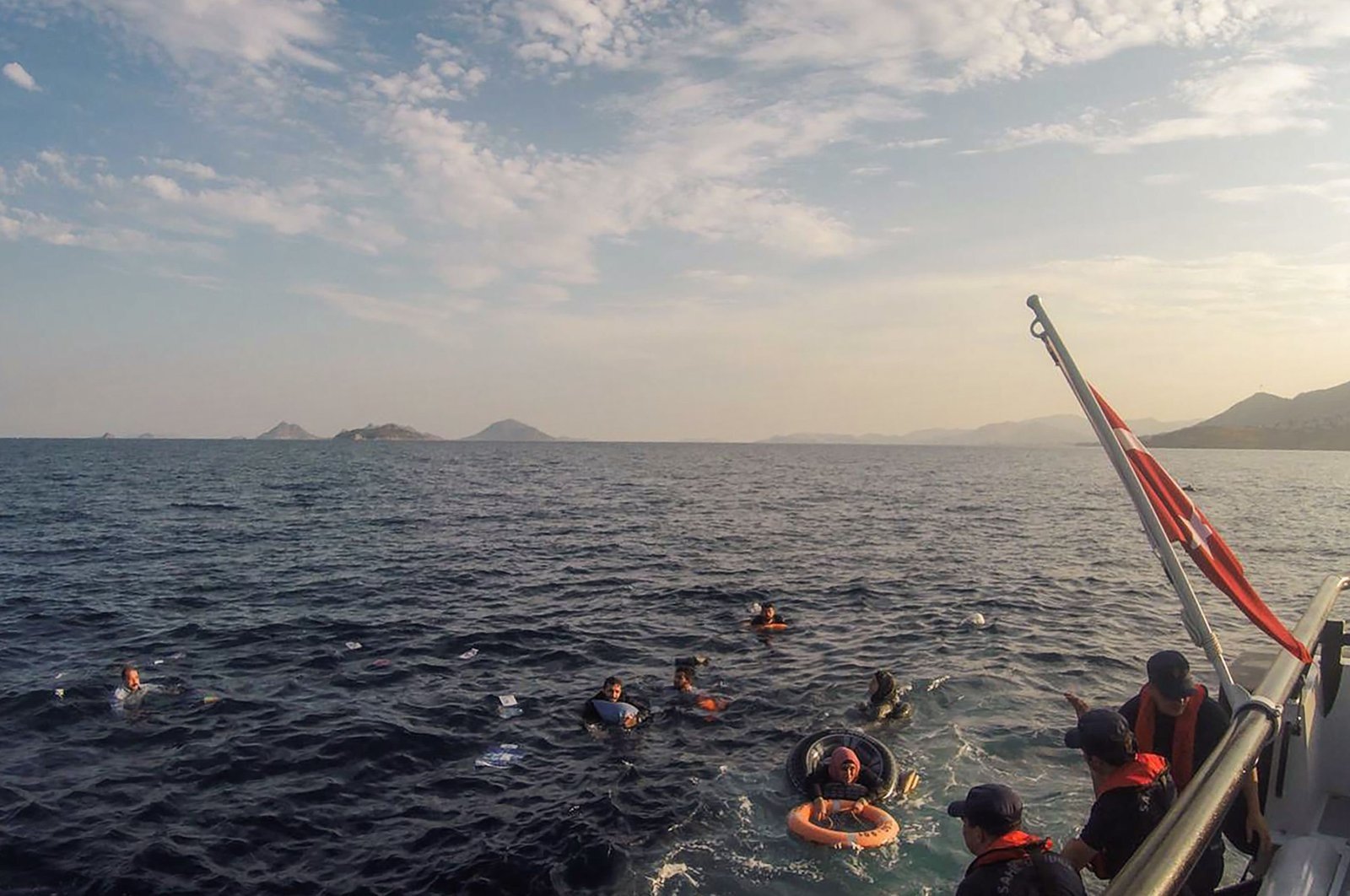 The Turkish coast guard rescues illegal migrants after their boat sank in the Aegean Sea, off the coast of southwestern Turkey, June 17, 2019. (AFP Photo)