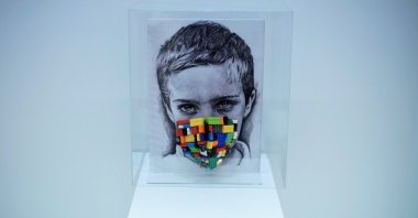 Simay Bülbül, "Childhood in the Glass Lantern," installation of Lego pieces, plexi, textile, 33 by 24 centimeters.