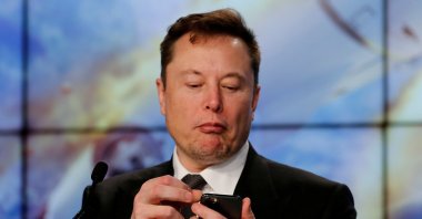 SpaceX founder and chief engineer Elon Musk looks at his mobile phone during a post-launch news conference to discuss the  SpaceX Crew Dragon astronaut capsule in-flight abort test at the Kennedy Space Center in Cape Canaveral, Florida, U.S. Jan. 19, 2020. (Reuters Photo)