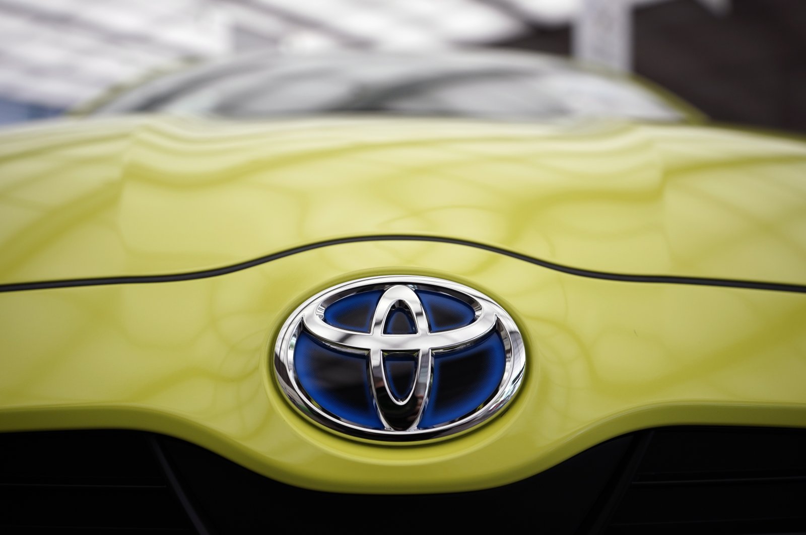 Toyota Motor logo is seen on a vehicle displayed at the carmaker's headquarters in Tokyo, Japan, Feb. 10, 2021. (EPA Photo)