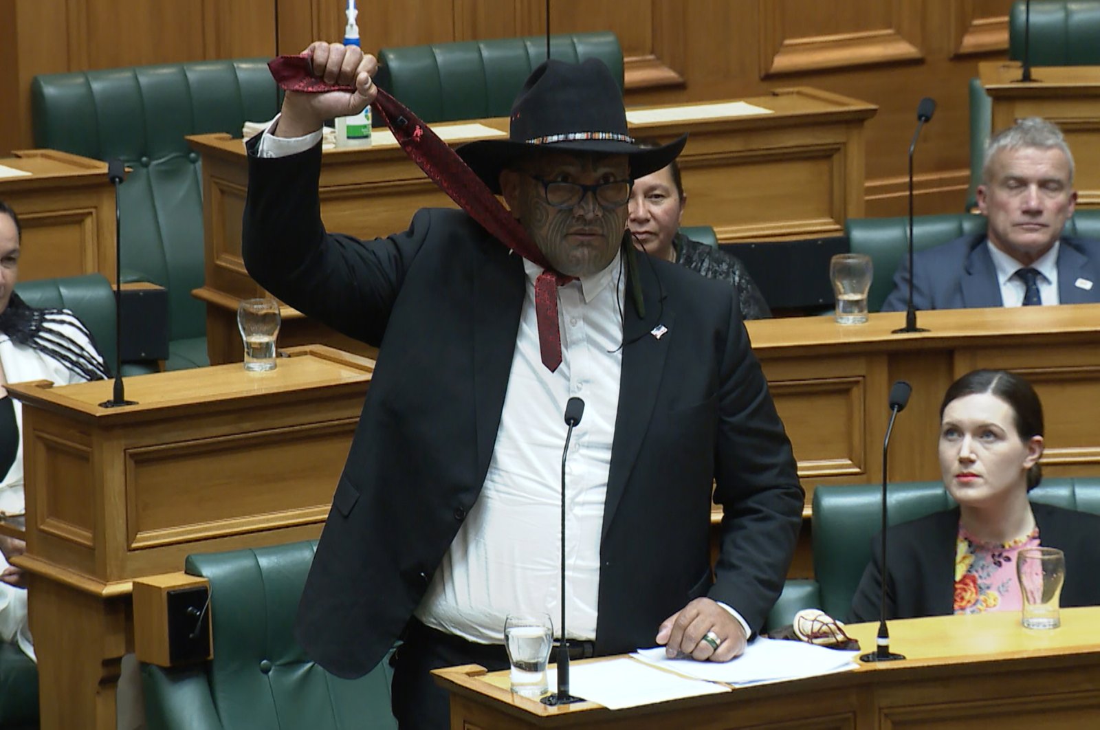 Co-leader of New Zealand's Maori party Rawiri Waititi simulates a noose in this television frame grab taken from TVNZ television on Dec. 3, 2020 (AFP)
