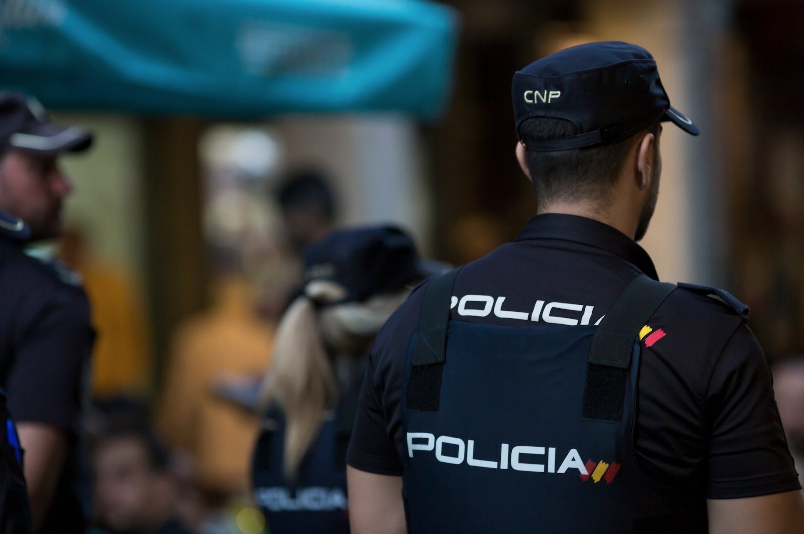 Several agents of the Spanish national police are seen standing guard in a protest against animal abuse in Alcala de Henares, Spain, Oct. 2019. (Shutterstock Photo)
