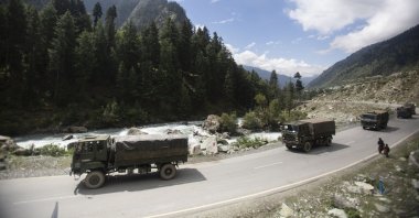 An Indian army convoy moves on the Srinagar-Ladakh highway toward the cold-desert Ladakh region where China and India have been engaged in a tense standoff since May, at Gagangeer, northeast of Srinagar, Indian-controlled Kashmir, Sept. 1, 2020.  (AP Photo)
