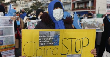 Members of the Uighur community living in Turkey, hold a protest near China's consulate in Istanbul, Turkey, Feb. 10, 2021. (AP Photo)