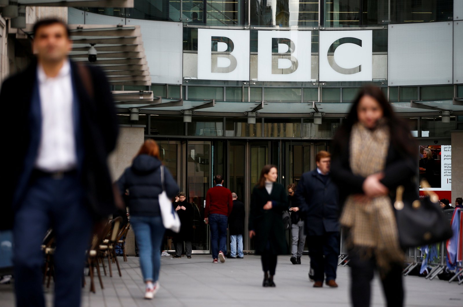 Pedestrians walk past a BBC logo at Broadcasting House in London, Britain, Jan. 29, 2020. (REUTERS Photo)