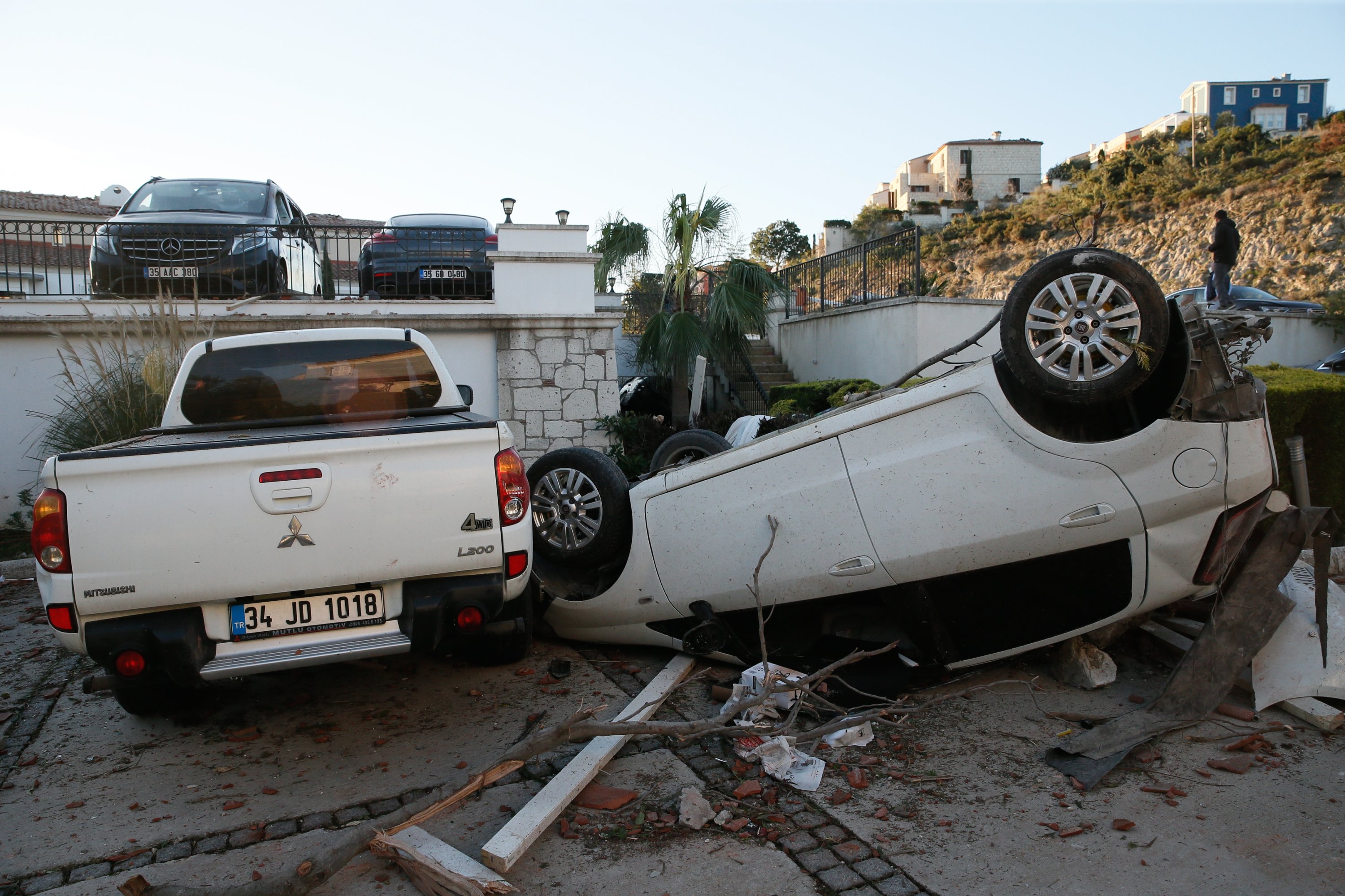 A car lies upside down after being flipped during a heavy storm in Çeşme, Izmir province, western Turkey, Feb. 12, 2021. (AA Photo)