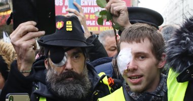 Wounded protest leader Jerome Rodrigues (L) and Franck, no family name given, attend a demonstration of the Yellow Vests in Paris, France, Feb. 2, 2019. (AP File Photo)