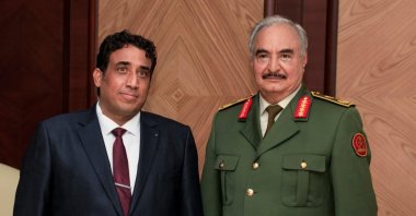 The president of Libya's recently elected transitional government, Mohammed Menfi (L), meets with putschist Gen. Khalifa Haftar in Benghazi, eastern Libya, Feb. 11, 2021 (AA Photo)