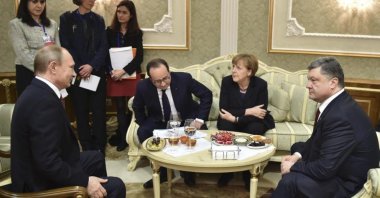 Russian President Vladimir Putin, then-French President Francois Hollande, German Chancellor Angela Merkel and then-Ukrainian President Petro Poroshenko hold a meeting in Minsk, Belarus, Feb. 11, 2015. (AP Photo)