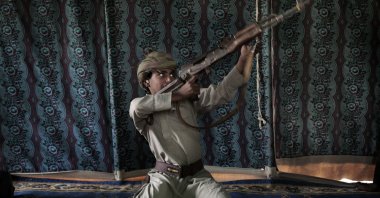 Kahlan, a 12-year-old former child soldier who fought alongside Houthi rebels, demonstrates how to use a weapon at a camp for displaced persons where he took shelter with his family in Marib, Yemen, July 27, 2018. (AP Photo)