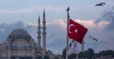 Seagulls fly over a Turkish flag in Istanbul, Turkey, May 3, 2016. (Getty Images)