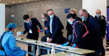 Peter Ben Embarek, and other members of the World Health Organization (WHO) team tasked with investigating the origins of the coronavirus disease (COVID-19), arrive at the Pudong International Airport in Shanghai, China on Feb. 10, 2021. (Reuters Photo)