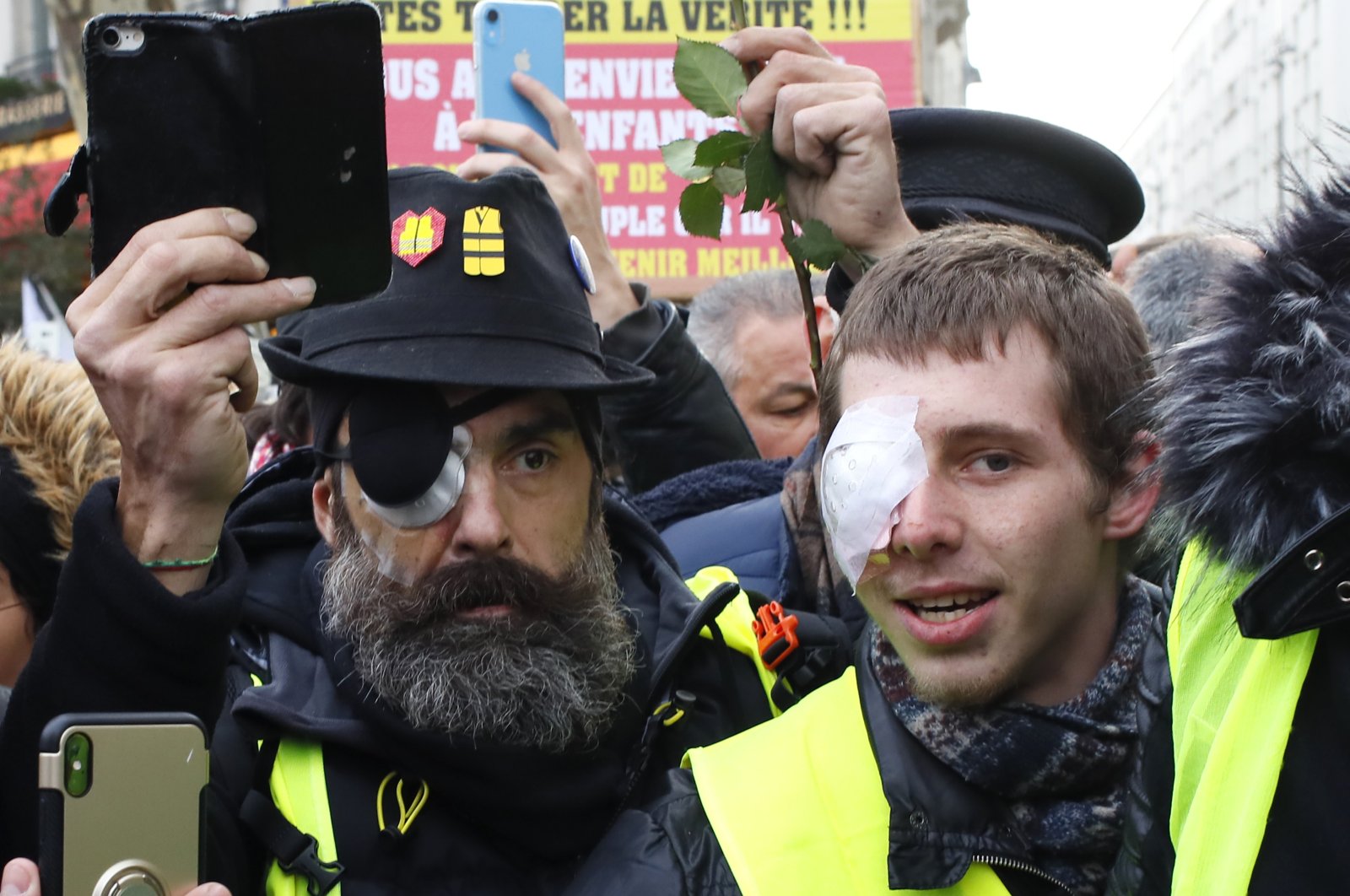 Wounded protest leader Jerome Rodrigues (L) and Franck, no family name given, attend a demonstration of the Yellow Vests in Paris, France, Feb. 2, 2019. (AP File Photo)