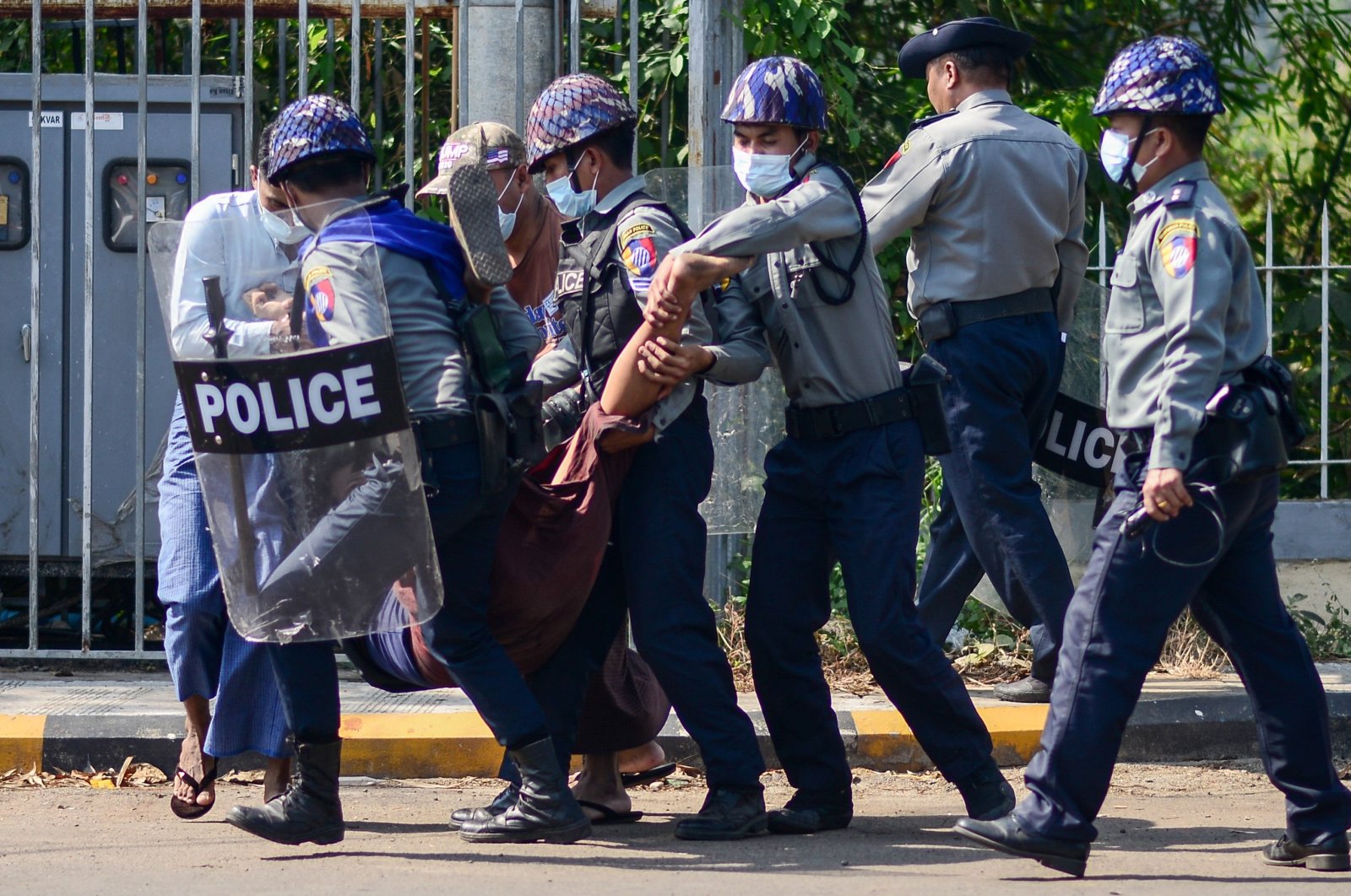Police arrest a protester during a demonstration against the military coup in Mawlamyine in Mon State, Myanmar, Feb., 12, 2021. (AFP Photo)