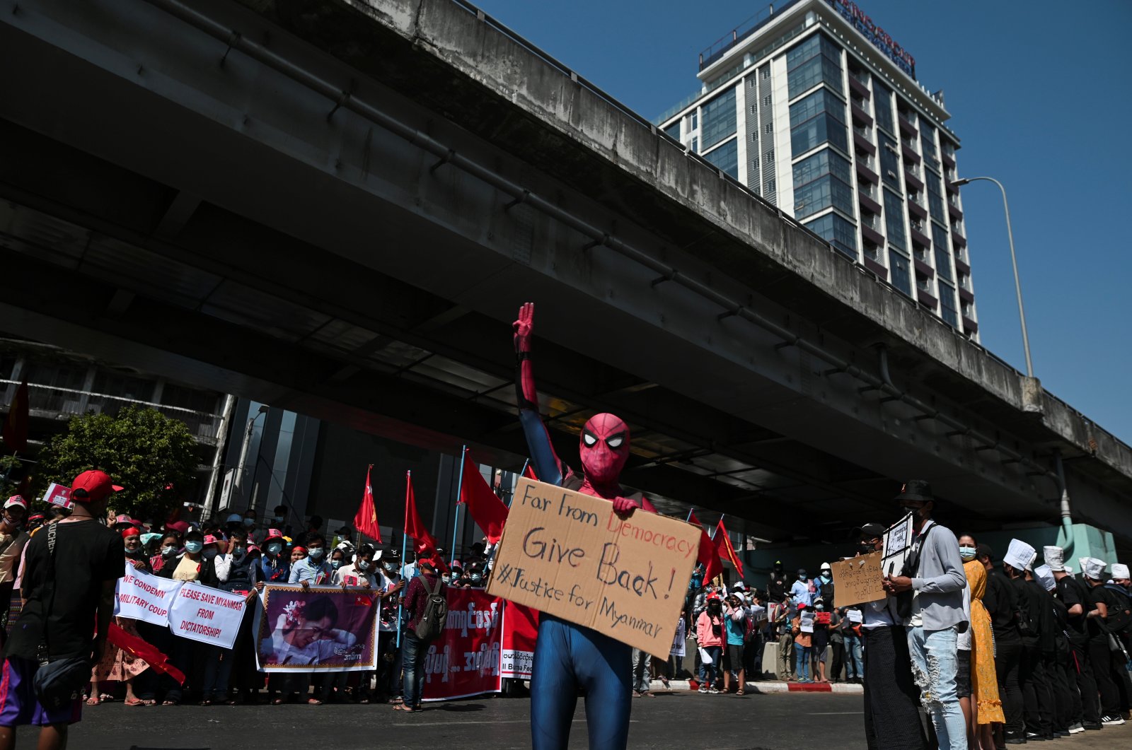 A protestor wearing a Spiderman costume gives the three-finger salute as he rallies against the military coup and to demand the release of elected leader Aung San Suu Kyi, in Yangon, Myanmar, Feb.10, 2021. (Reuters Photo)
