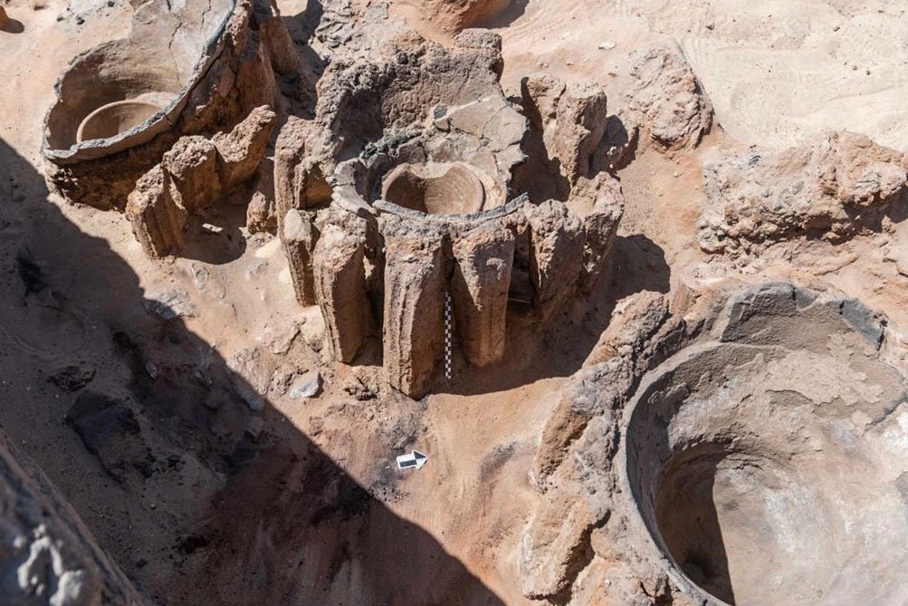 A handout picture released by the Egyptian Ministry of Tourism and Antiquities on Feb. 13, 2021, shows the remains of vats used for beer fermentation, in a complex that may be the world