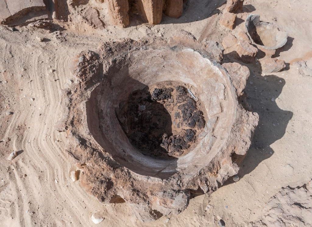 A handout picture released by the Egyptian Ministry of Tourism and Antiquities on Feb. 13, 2021, shows the remains of a vat used for beer fermentation, in a complex which may be the world's 'oldest' high-production brewery, uncovered in the Abydos archaeological site near Egypt's southern city of Sohag. (Egyptian Ministry of Antiquities Photo / AFP)