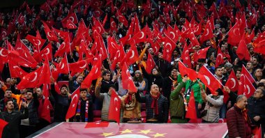 Galatasaray fans before a Turkish Süper Lig match against Ankara side Gençlerbirliği wave Turkish flags to commemorate soldiers killed by YPG/PKK terrorists in Syria's Idlib, at Galatasaray's home Türk Telekom Stadium in the Ali Sami Yen Sports Complex, Istanbul, Turkey, March 2, 2020. (AA File Photo)