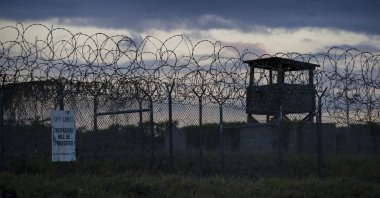 The sun sets behind the closed Camp X-Ray detention facility, at the U.S.' Guantanamo Bay Naval Base, Cuba, April 17, 2019. (AP Photo)