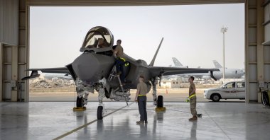 In this photo released by the U.S. Air Force, an F-35 fighter jet pilot and crew prepare for a mission at Al-Dhafra Air Base in the United Arab Emirates, Aug. 5, 2019. (AP Photo)