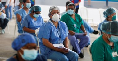 Health workers wait for a dose of the Sinopharm's coronavirus vaccine in Lima, Peru, Feb. 9, 2021. (Reuters Photo)