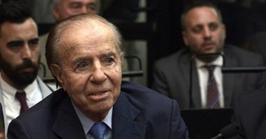 In this file photo Argentine former president and current senator Carlos Menem gestures before hearing his sentence during his trial over accusations of attempting to block the 1994 AMIA bombing investigation, in Buenos Aires taken on Feb. 28, 2019. (AP Photo)