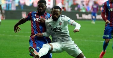 Trabzonspor's Djaniny (L) and Beşiktaş's Georges-Kévin Nkoudou (R) vie for the ball in their Turkish Süper Lig match at the Vodafone Stadium, Istanbul, Turkey, Jan. 31, 2021. (IHA Photo)
