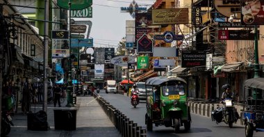 A tuk-tuk drives down Khao San Road, a once-popular tourist strip in Bangkok, Thailand, Feb. 15, 2021, as the country records it worst economic performance in more than two decades. (AFP Photo)