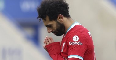 Liverpool's Mohamed Salah (R) celebrates scoring a goal against Leicester City at the King Power Stadium, Leicester, England, Feb. 13, 2021. (AP Photo)