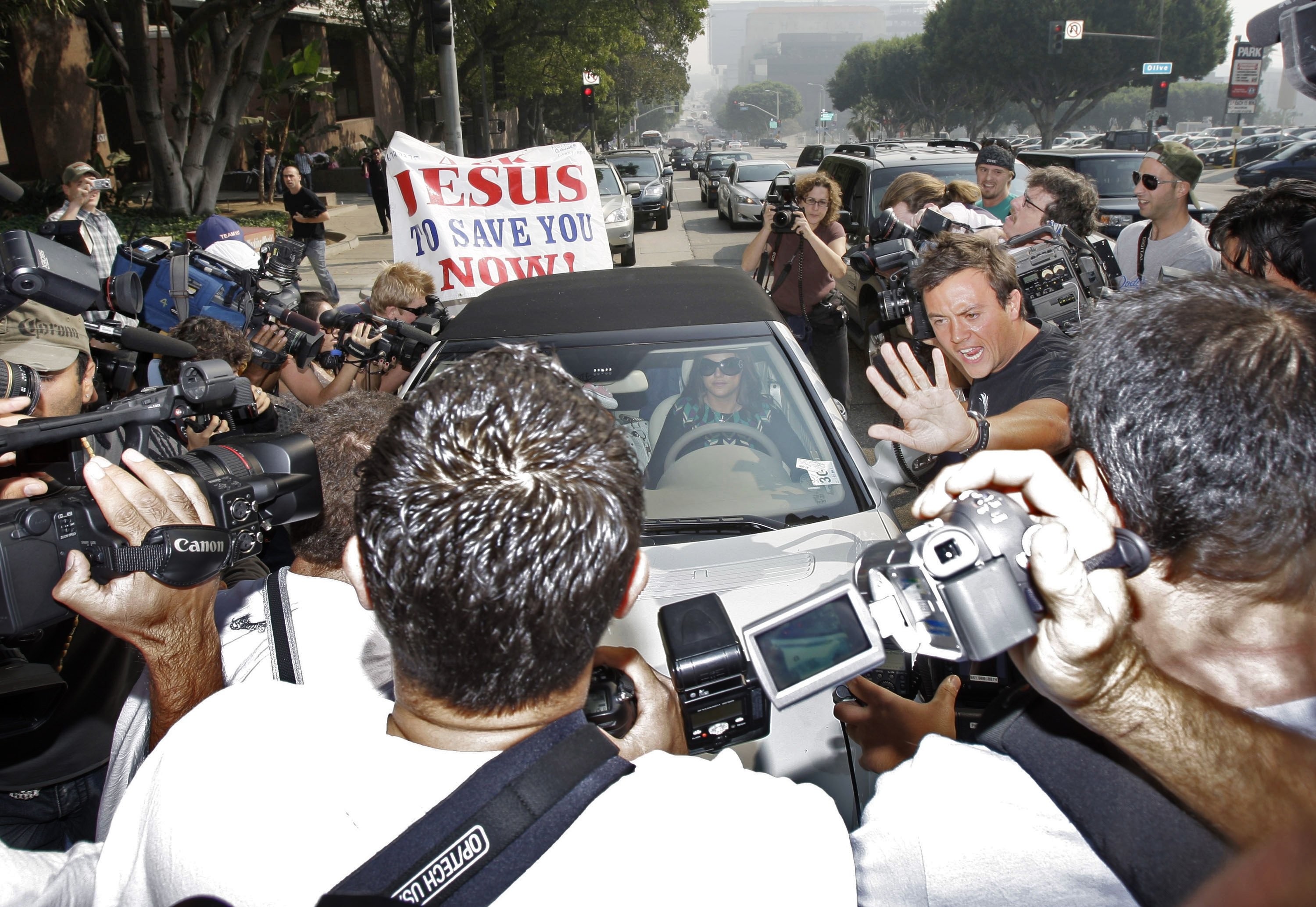 In this file photo, paparazzi surround Britney Spears as she arrives at a court hearing in Los Angeles on Oct. 26, 2007. (AP Photo)