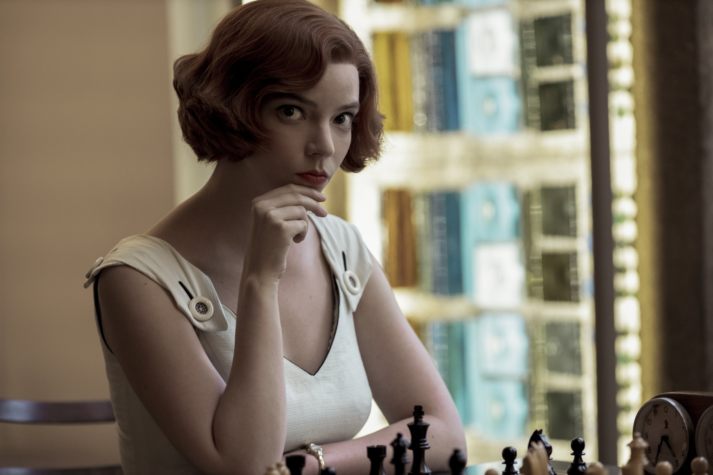 A still shot from 'The Queen's Gambit' where Anya Taylor-Joy's character thinks before making her next move in a chess match. (Netflix via AP)