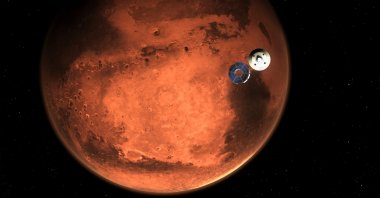 An illustration of NASA’s “Perseverance” rover casting off its spacecraft’s cruise stage, minutes before entering the Martian atmosphere, photo obtained on Feb. 15, 2021. (NASA Handout via AFP)