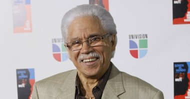 In this file photo, Dominican artist Johnny Pacheco poses for photographers in Miami, Florida, U.S., Feb. 19, 2019 (AP PHOTO)