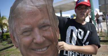 Jonny Riches and other supporters of former U.S. President Donald Trump gather along Southern Blvd near Trump's Mar-a-Lago home in West Palm Beach, Florida, Feb. 15, 2021. (AFP Photo)