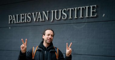 A member of the protest group Viruswaarheid (Virus Truth) Willem Engel arrives at the court of appeal where the Dutch state asked the court to suspend the judge's decision to cancel the nationwide curfew, in The Hague, The Netherlands, Feb. 16, 2021. (AFP Photo)