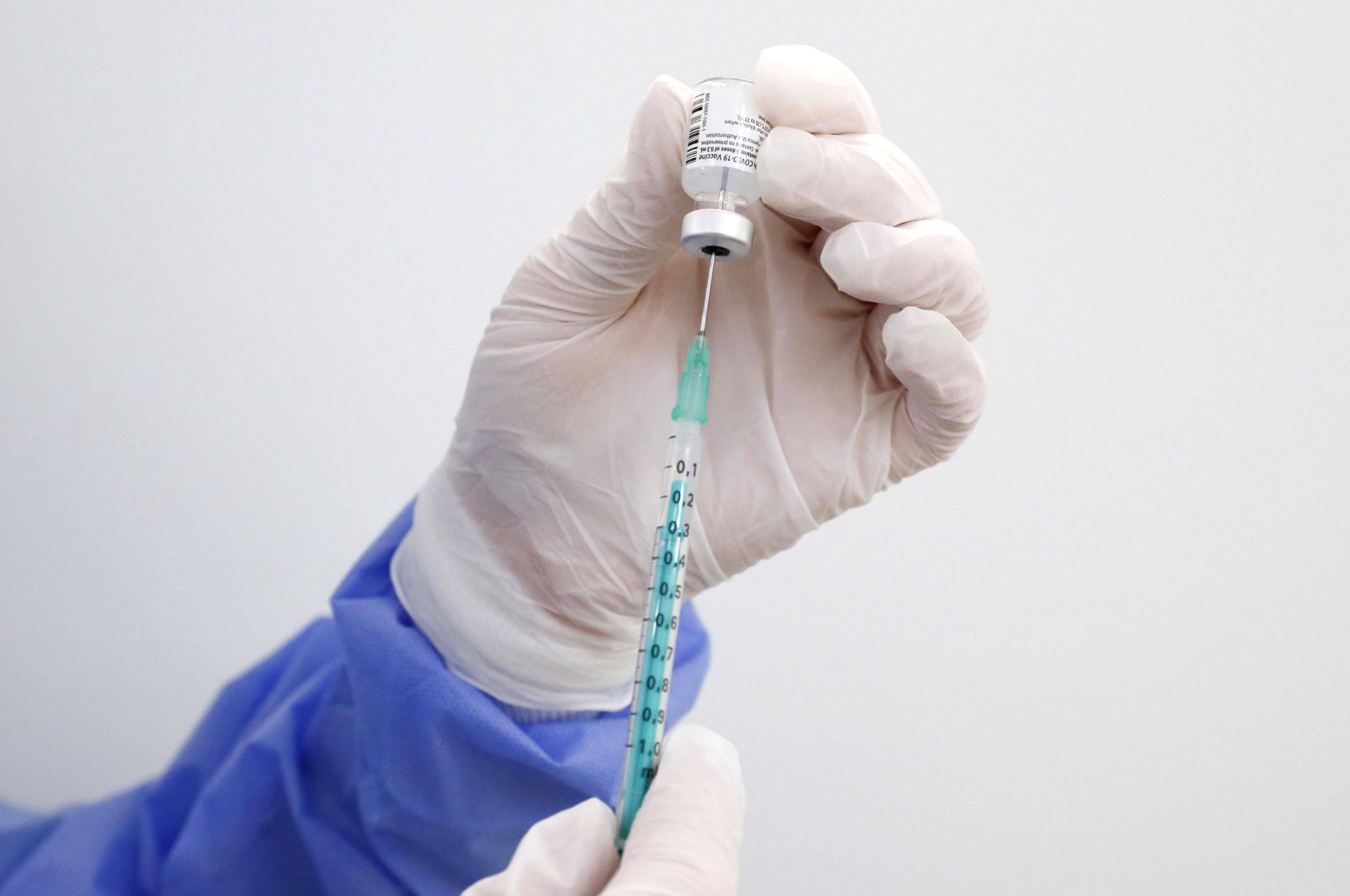 A syringe is filled with the Biontech Pfizer vaccine against COVID-19, in the vaccination center at Terminal 5 of BER airport, Feb 15, 2021, Schonefeld Brandenburg, Germany. (Reuters Photo)