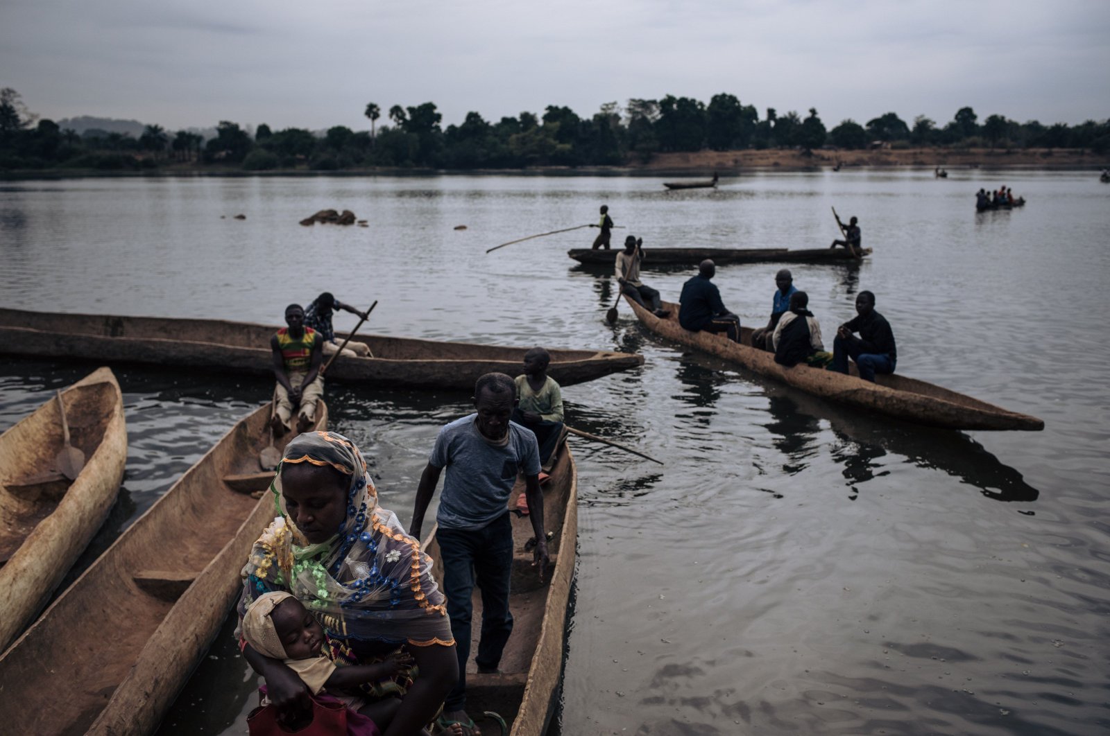 Central African refugees arrive in Ndu after crossing the Mbomou River, which marks the border between the Central African Republic and the Democratic Republic of Congo, on Feb. 5, 2021. (AFP Photo)