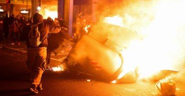 People participate in a protest in support of Catalan rap singer Pablo Hasel after he was given a jail sentence on charges of glorifying terrorism and insulting royalty in his songs, in Barcelona, Spain, Feb. 16, 2021. (Reuters Photo)