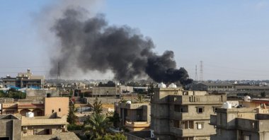 This picture shows smoke plumes rising in Tajoura, south of the Libyan capital Tripoli, following a reported airstrike by forces loyal to retired Gen. Khalifa Haftar, June 29, 2019. (AFP File Photo)