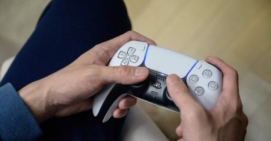 A gamer plays on the new Sony Playstation PS5 at his home in Seoul, South Korea, Nov. 12, 2020. (AFP Photo)