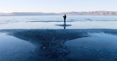 A man stands on an islet at Lake Salda, in Burdur, southwestern Turkey, Feb. 18, 2021. (DHA Photo)