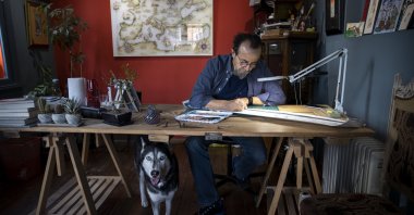 Miniature artist Taner Alakuş works at his workshop in Istanbul, Turkey, Feb. 16, 2021. (AA PHOTO)