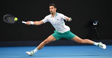 Serbia's Novak Djokovic in action against Russia's Aslan Karatsev in the Australian Open men's singles semifinal at Melbourne Park, Melbourne, Feb. 18, 2021. (EPA Photo)