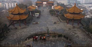 People wearing face masks visit the Yellow Crane Tower, Wuhan, China, Jan. 28, 2021. (Photo by Getty Images)