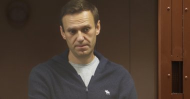 Kremlin critic Alexei Navalny stands inside a defendant dock during a court hearing in Moscow, Russia, Feb. 12, 2021. (Reuters Photo)